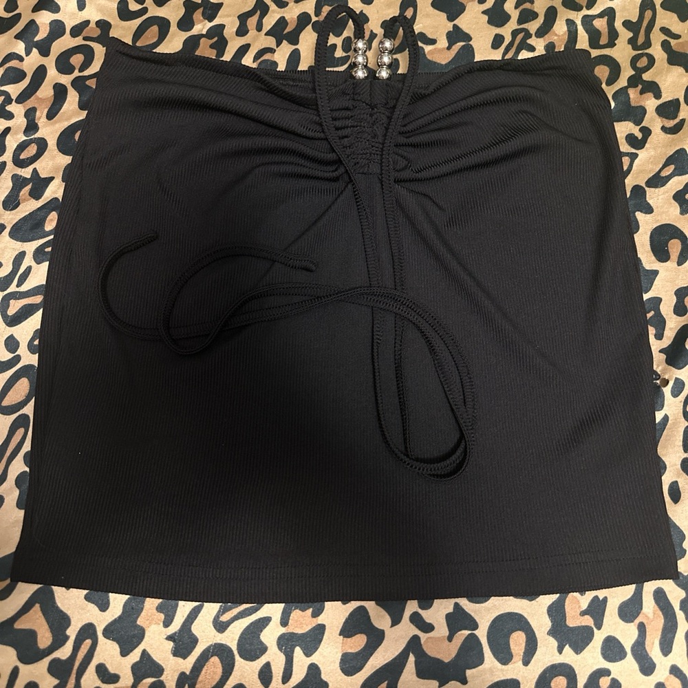 black halter neck crop top/black skirt with tie